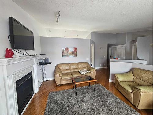 137 Fox Crescent, Fort Mcmurray, AB - Indoor Photo Showing Living Room With Fireplace