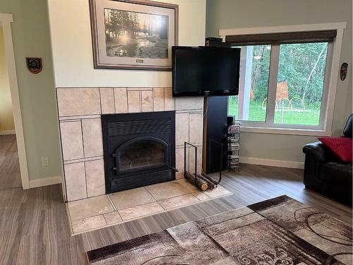 67325, 834 Churchill Park Road, Rural Lac La Biche County, AB - Indoor Photo Showing Living Room With Fireplace