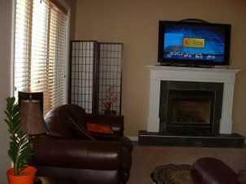 248 Paulson Street, Fort Mcmurray, AB - Indoor Photo Showing Living Room With Fireplace