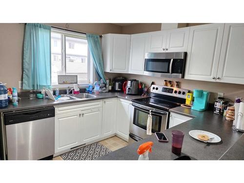 29-100 Millennium Gate, Fort Mcmurray, AB - Indoor Photo Showing Kitchen With Double Sink