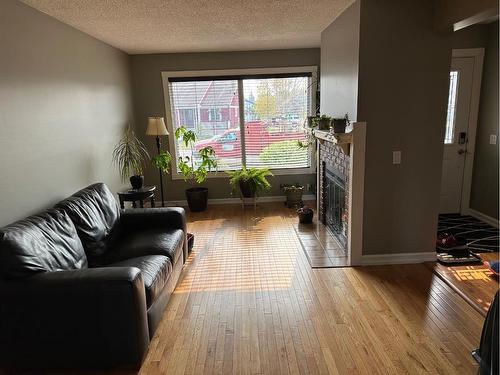 321 Bird Crescent Ne, Fort Mcmurray, AB - Indoor Photo Showing Living Room With Fireplace