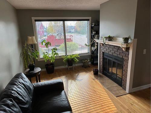 321 Bird Crescent Ne, Fort Mcmurray, AB - Indoor Photo Showing Living Room With Fireplace