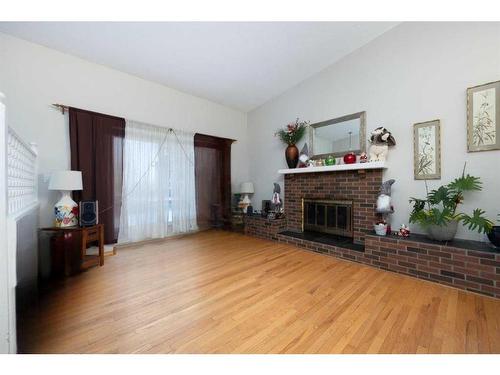 106 Silver Springs Drive, Fort Mcmurray, AB - Indoor Photo Showing Living Room With Fireplace