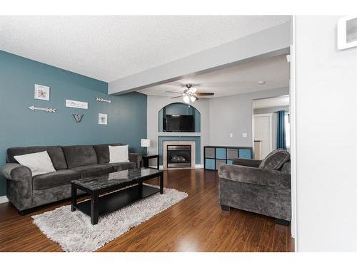 211 Bear Paw Drive, Fort Mcmurray, AB - Indoor Photo Showing Living Room With Fireplace