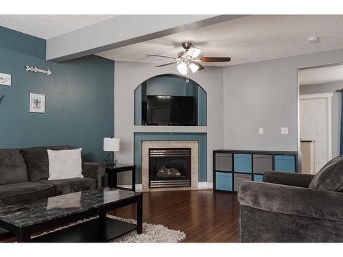 211 Bear Paw Drive, Fort Mcmurray, AB - Indoor Photo Showing Living Room With Fireplace