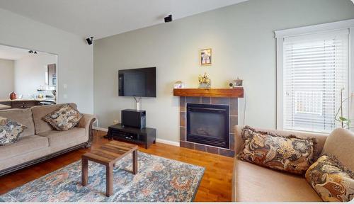 390 Pacific Crescent, Fort Mcmurray, AB - Indoor Photo Showing Living Room With Fireplace