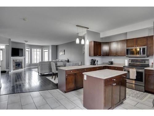 269 Grosbeak Way, Fort Mcmurray, AB - Indoor Photo Showing Kitchen With Fireplace