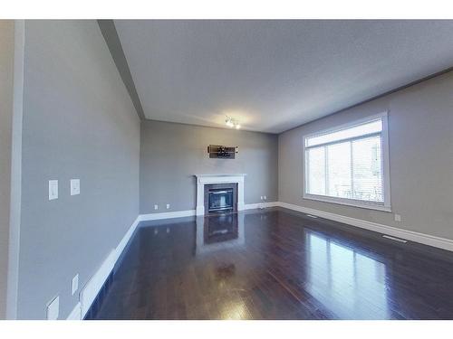 134 Mayflower Bay, Fort Mcmurray, AB - Indoor Photo Showing Other Room With Fireplace
