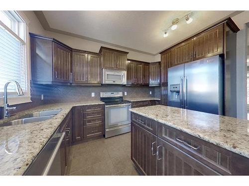 134 Mayflower Bay, Fort Mcmurray, AB - Indoor Photo Showing Kitchen With Double Sink