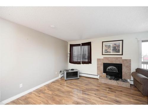 204-610 Signal Road, Fort Mcmurray, AB - Indoor Photo Showing Living Room With Fireplace