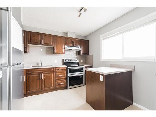 50-400 Silin Forest Road, Fort Mcmurray, AB - Indoor Photo Showing Kitchen With Stainless Steel Kitchen With Double Sink