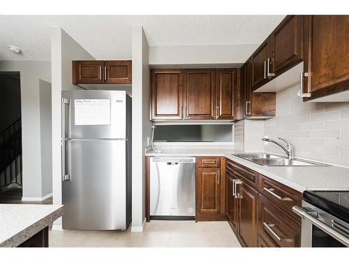 50-400 Silin Forest Road, Fort Mcmurray, AB - Indoor Photo Showing Kitchen With Double Sink