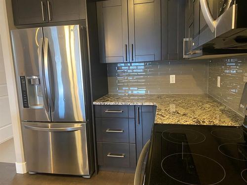 173 Collicott Drive, Fort Mcmurray, AB - Indoor Photo Showing Kitchen With Stainless Steel Kitchen