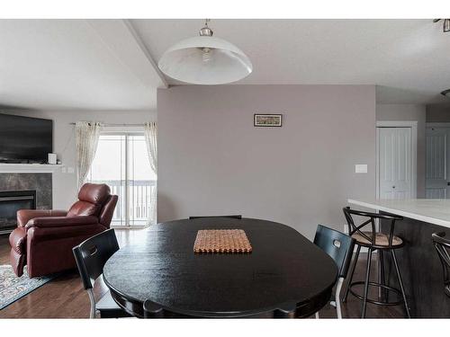 410 Grosbeak Way, Fort Mcmurray, AB - Indoor Photo Showing Dining Room With Fireplace