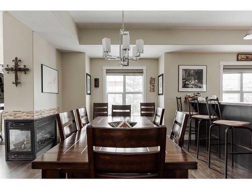 1-300 Sparrow Hawk Drive, Fort Mcmurray, AB - Indoor Photo Showing Dining Room With Fireplace