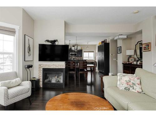 1-300 Sparrow Hawk Drive, Fort Mcmurray, AB - Indoor Photo Showing Living Room With Fireplace