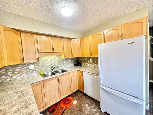 9104A 94 Ave., Lac La Biche, AB - Indoor Photo Showing Kitchen With Double Sink