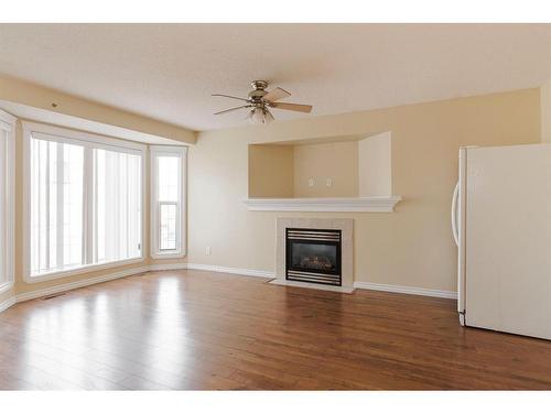 299 Laffont Way, Fort Mcmurray, AB - Indoor Photo Showing Living Room With Fireplace
