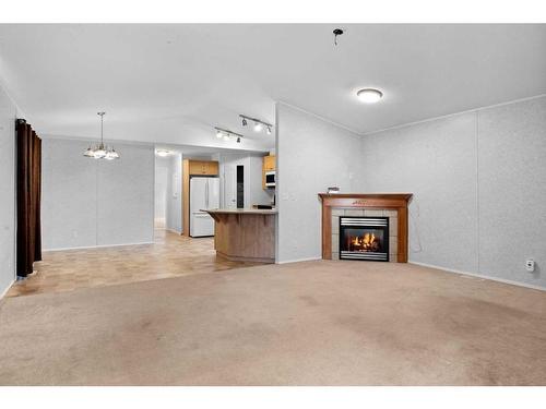 264 Caouette Crescent, Fort Mcmurray, AB - Indoor Photo Showing Living Room With Fireplace