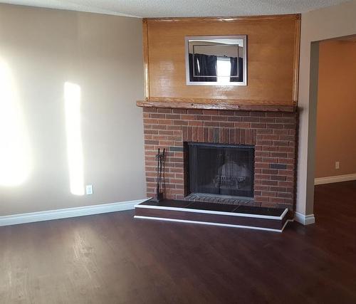 122 Erindale Road, Fort Mcmurray, AB - Indoor Photo Showing Living Room With Fireplace