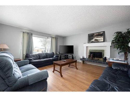 3 Armit, Fort Mcmurray, AB - Indoor Photo Showing Living Room With Fireplace