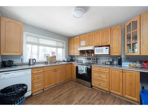 3 Armit, Fort Mcmurray, AB - Indoor Photo Showing Kitchen With Double Sink