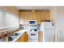 305-10101 Morrison Street, Fort Mcmurray, AB  - Indoor Photo Showing Kitchen With Double Sink 