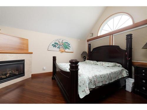 119 Pew Lane, Fort Mcmurray, AB - Indoor Photo Showing Bedroom With Fireplace