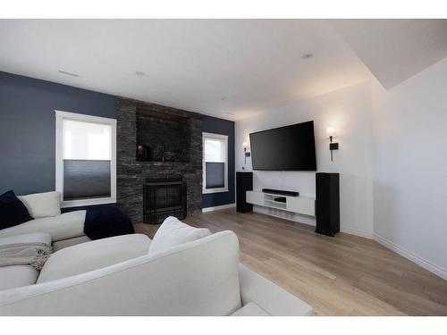 180 Merganser Crescent, Fort Mcmurray, AB - Indoor Photo Showing Living Room With Fireplace