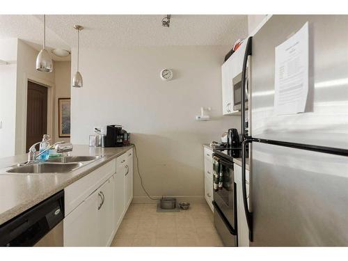 215-136A Sandpiper Road, Fort Mcmurray, AB - Indoor Photo Showing Kitchen With Stainless Steel Kitchen With Double Sink