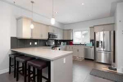 104 Collicott Drive, Fort Mcmurray, AB - Indoor Photo Showing Kitchen With Stainless Steel Kitchen With Upgraded Kitchen