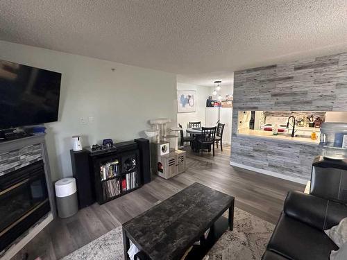 419-100 Richard Street, Fort Mcmurray, AB - Indoor Photo Showing Living Room With Fireplace