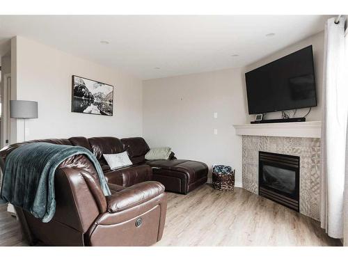 221 Lynx Crescent, Fort Mcmurray, AB - Indoor Photo Showing Living Room With Fireplace
