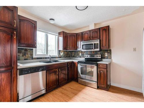248 Bacon Place, Fort Mcmurray, AB - Indoor Photo Showing Kitchen With Double Sink