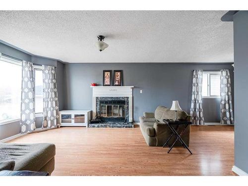 248 Bacon Place, Fort Mcmurray, AB - Indoor Photo Showing Living Room With Fireplace