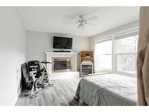 149 Whiteoak Garden, Fort Mcmurray, AB - Indoor Photo Showing Bedroom With Fireplace