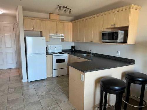 605-8528 Manning Avenue, Fort Mcmurray, AB - Indoor Photo Showing Kitchen With Double Sink