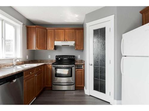 393 Diefenbaker Drive, Fort Mcmurray, AB - Indoor Photo Showing Kitchen With Double Sink