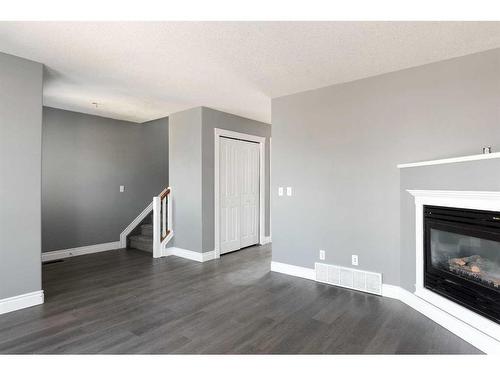 393 Diefenbaker Drive, Fort Mcmurray, AB - Indoor Photo Showing Living Room With Fireplace