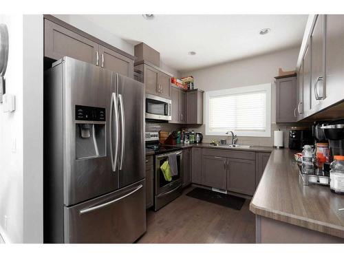 143 Merganser Crescent, Fort Mcmurray, AB - Indoor Photo Showing Kitchen With Stainless Steel Kitchen With Double Sink