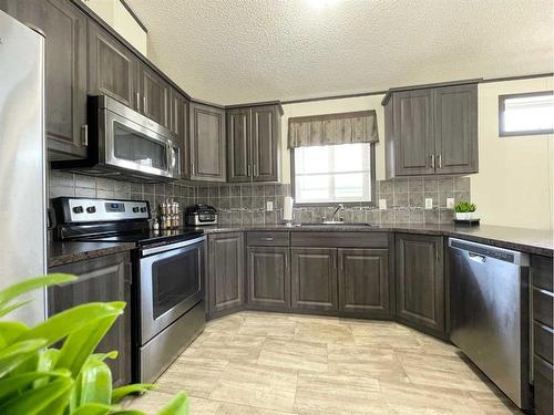 145 Caouette Crescent, Fort Mcmurray, AB - Indoor Photo Showing Kitchen With Stainless Steel Kitchen With Upgraded Kitchen