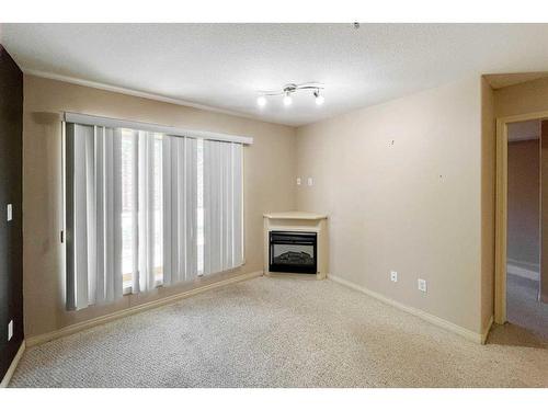 2107-200 Lougheed Drive, Fort Mcmurray, AB - Indoor Photo Showing Other Room With Fireplace