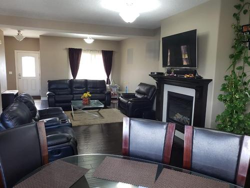 577 Heritage Drive, Fort Mcmurray, AB - Indoor Photo Showing Living Room With Fireplace