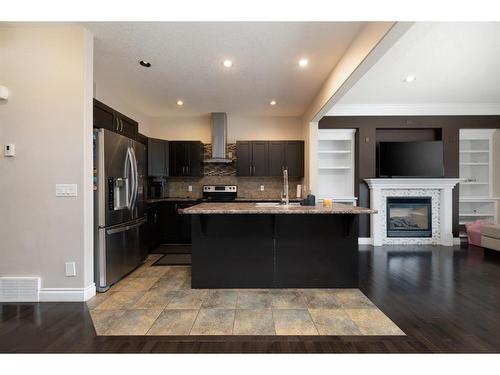 137 Shalestone Way, Fort Mcmurray, AB - Indoor Photo Showing Kitchen With Fireplace With Upgraded Kitchen