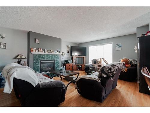 221 Sitka Drive, Fort Mcmurray, AB - Indoor Photo Showing Living Room With Fireplace