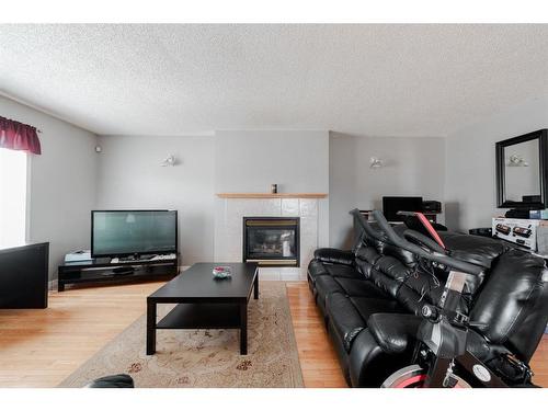 221 Sitka Drive, Fort Mcmurray, AB - Indoor Photo Showing Living Room With Fireplace