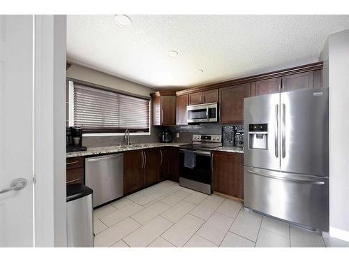 19 Maciver Street, Fort Mcmurray, AB - Indoor Photo Showing Kitchen With Double Sink