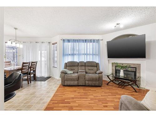 153 Cinnamon Street, Fort Mcmurray, AB - Indoor Photo Showing Living Room With Fireplace