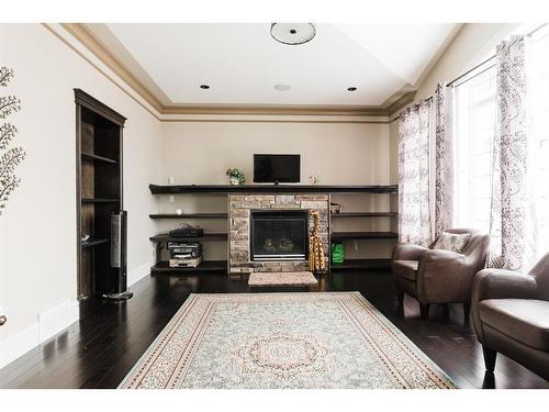 145 Stonecreek Landing, Fort Mcmurray, AB - Indoor Photo Showing Living Room With Fireplace