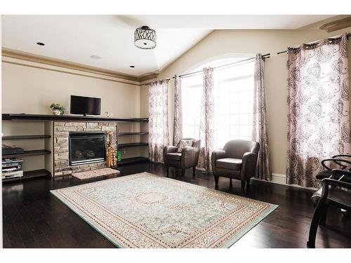 145 Stonecreek Landing, Fort Mcmurray, AB - Indoor Photo Showing Living Room With Fireplace